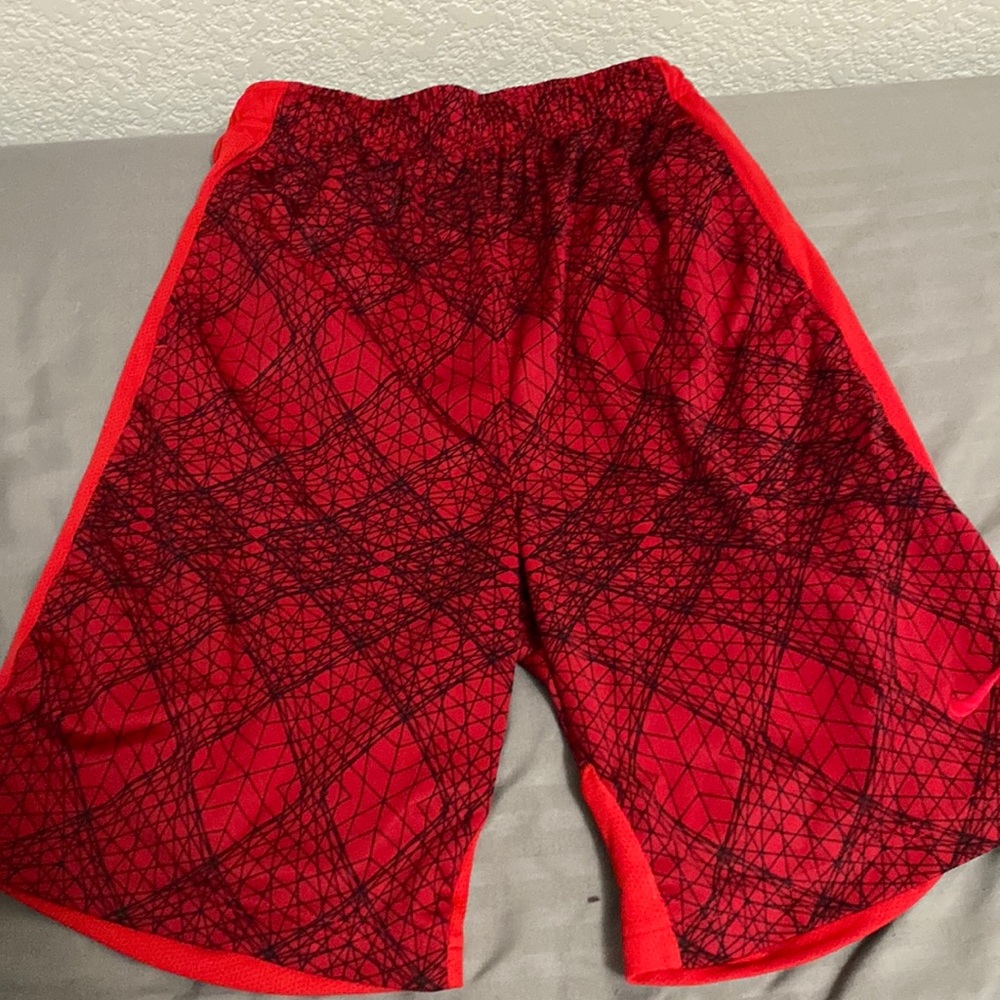 Two pairs of boy basketball shorts